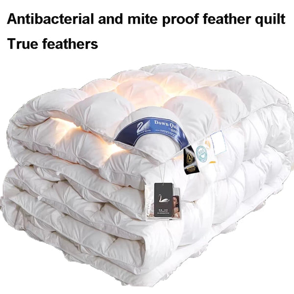 A fluffy white feather quilt filled with true feathers and designed to be antibacterial and mite proof.