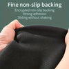 Close-up of a black non-slip backing material being held, showing strong adhesion and smooth sliding.