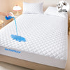 A white quilted mattress protector is shown with water dripping onto it, emphasizing its waterproof feature.