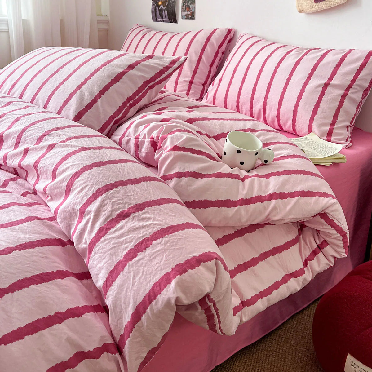Pink soft washed cotton stripe duvet cover set with pillowcases featuring pink and white stripes.
