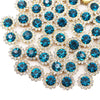 Close-up of sunflower crystal rhinestone sew-on buttons in blue and clear pave setting.