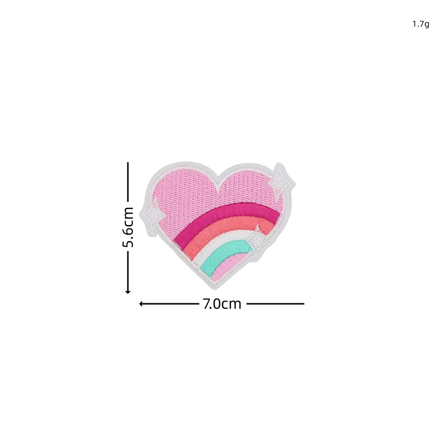 A heart-shaped embroidered patch featuring a rainbow design in pink, orange, and teal colors.