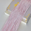 Pink decorative door string curtains displayed next to a box.
