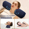 A woman is using a dark blue memory foam cervical pillow for neck support while sleeping on her side.