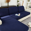A navy blue jacquard knit sofa cushion cover featuring a textured weave and light cream trim.