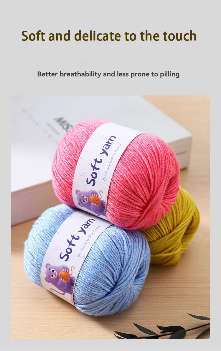 A stack of pink, blue, and yellow soft yarn skeins for hand knitting.