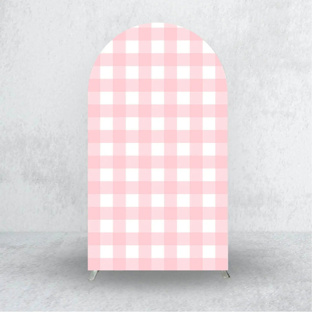 A vertical pink and white checkered fabric arch backdrop cover for events