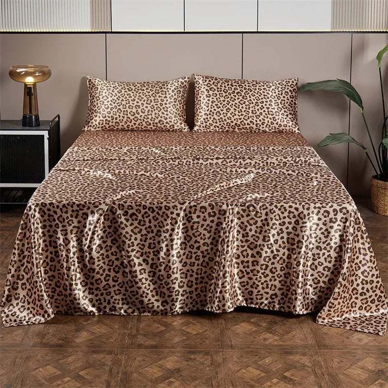 Leopard print satin bed sheet set displayed on a bed with modern decor.