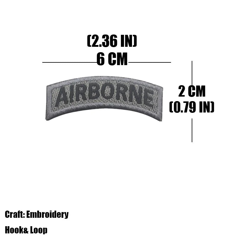 Gray embroidered tactical patch measuring 2.36 inches long and 2 cm wide.