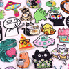 A collection of embroidered iron-on patches featuring various cartoon cats and animals.