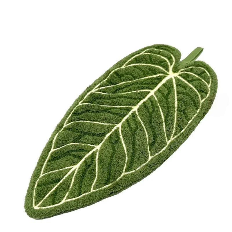 A decorative banana leaf hanging hand towel in green with white veining.