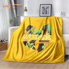 A bright yellow flannel throw blanket featuring a colorful abstract design with the word WUTANG printed on it.