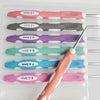 A set of ergonomic crochet hooks and needles in various sizes and colors displayed in a clear plastic tray.