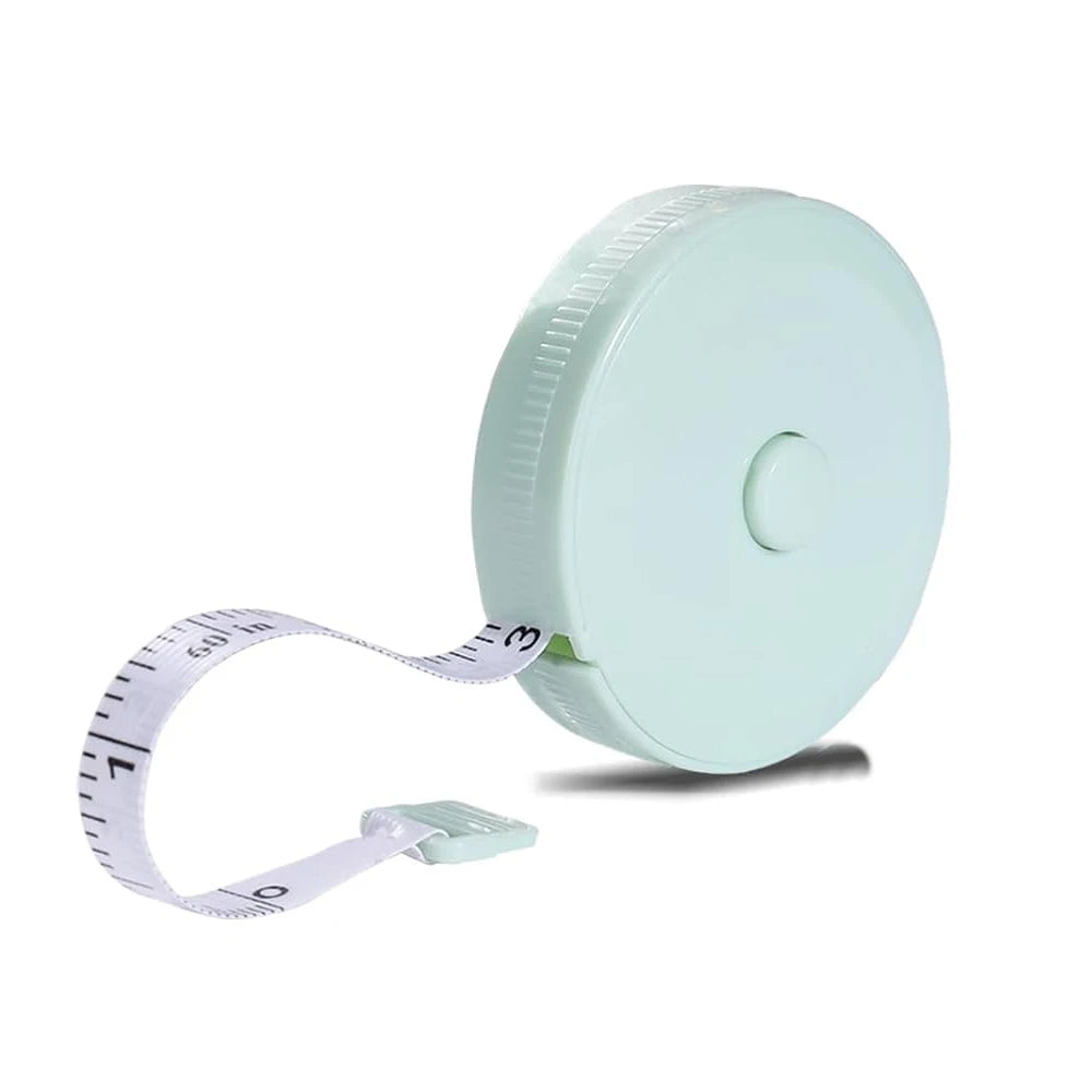 A light mint green flexible body measuring tape with a white strap and a circular plastic reel.