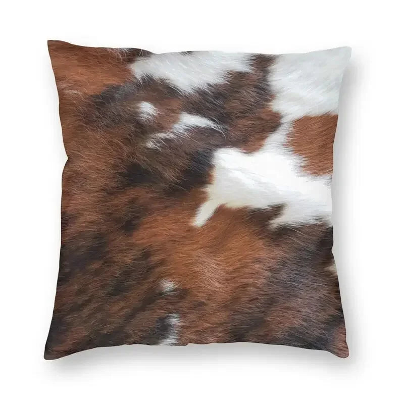 A square cushion cover featuring a brown and white cowhide print with a hidden zipper.