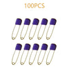 A collection of 100 stainless steel diaper pins with purple safety locking closures.