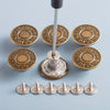 A set of adjustable no-sew metal denim buttons in gold and silver tones arranged on a light blue surface.