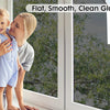 A mother holds a child in front of a window with clear glass, demonstrating the flat, smooth finish of privacy film.