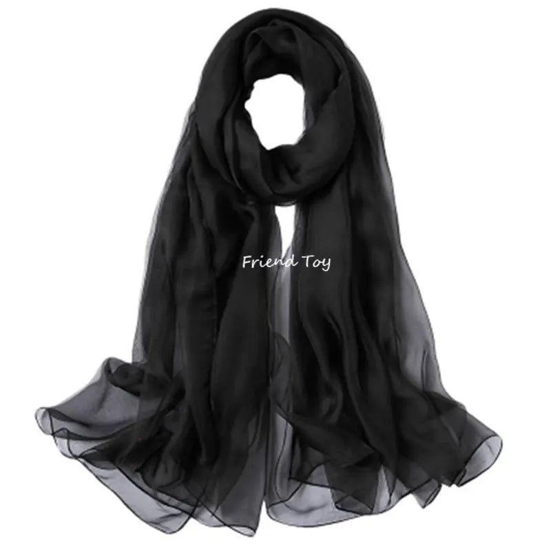 Black sheer scarf draped elegantly