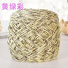 A ball of metallic silk crocheting and knitting yarn in a yellowish-green color.