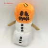 An orange and white stuffed dragon plush toy with a menacing face.