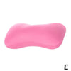 A pink microbead neck pillow shown from the side.