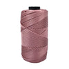 A spool of pink cotton silk thread used for knitting and crafting.