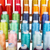 Bulk rolls of premium polyester embroidery thread in various vibrant colors and shades