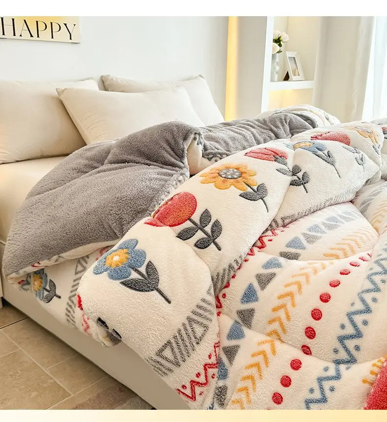 A close-up of a super thick lambswool winter blanket with various textures and floral patterns on a bed.