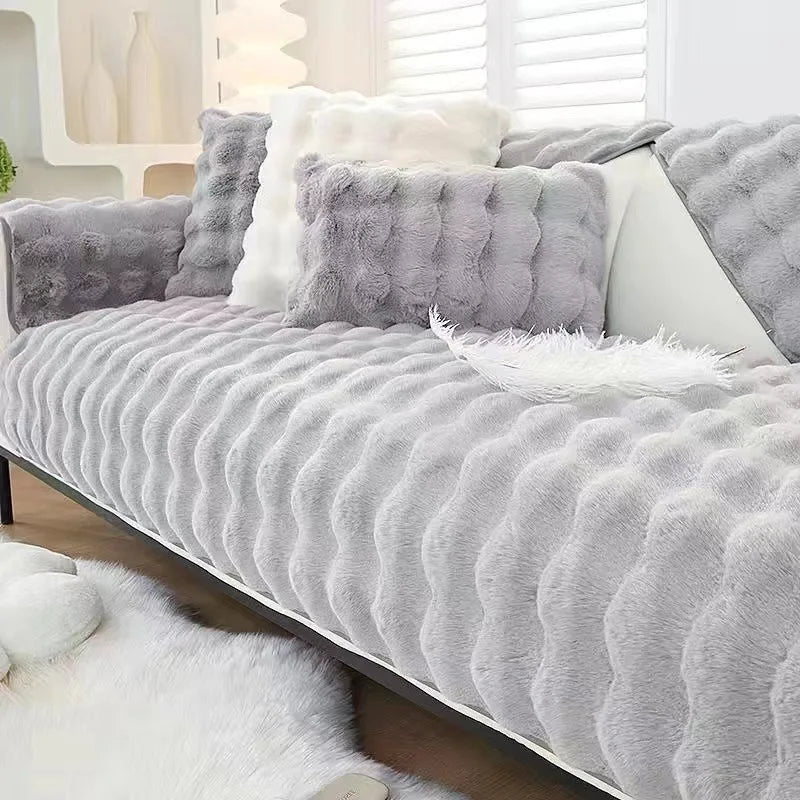 Gray plush rabbit fur sofa cushion cover with white accents and fluffy texture