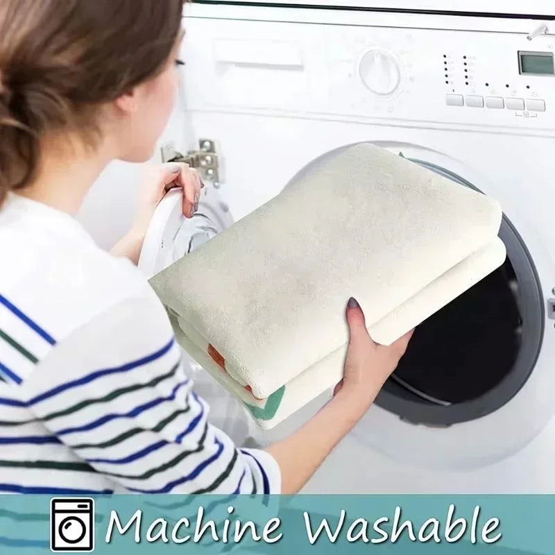A person is loading a white fabric item into a washing machine, with text indicating the machine is washable.