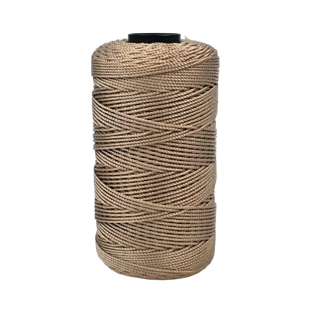 Spool of tan cotton silk thread for knitting and crafting