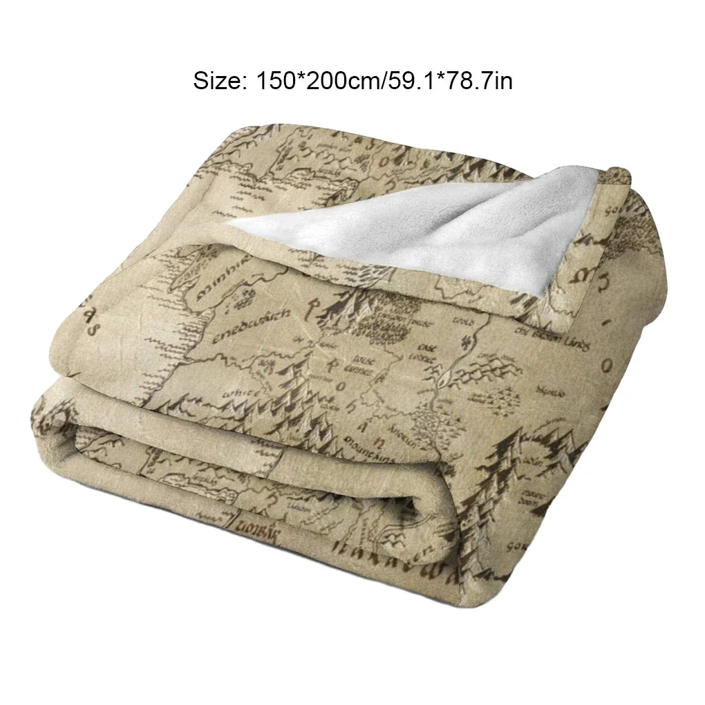 A beige blanket featuring a faded map design inspired by Lord of the Rings
