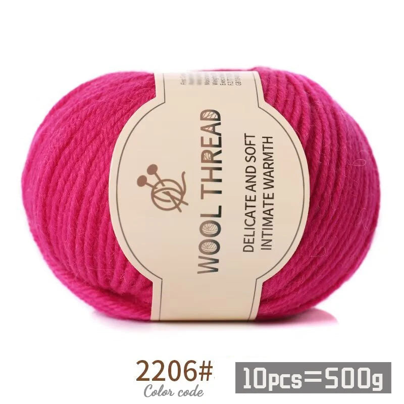 Pink wool thread skein with a label indicating delicate and soft intimate warmth