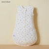 White cotton sleep sack for baby or toddler with yellow star pattern