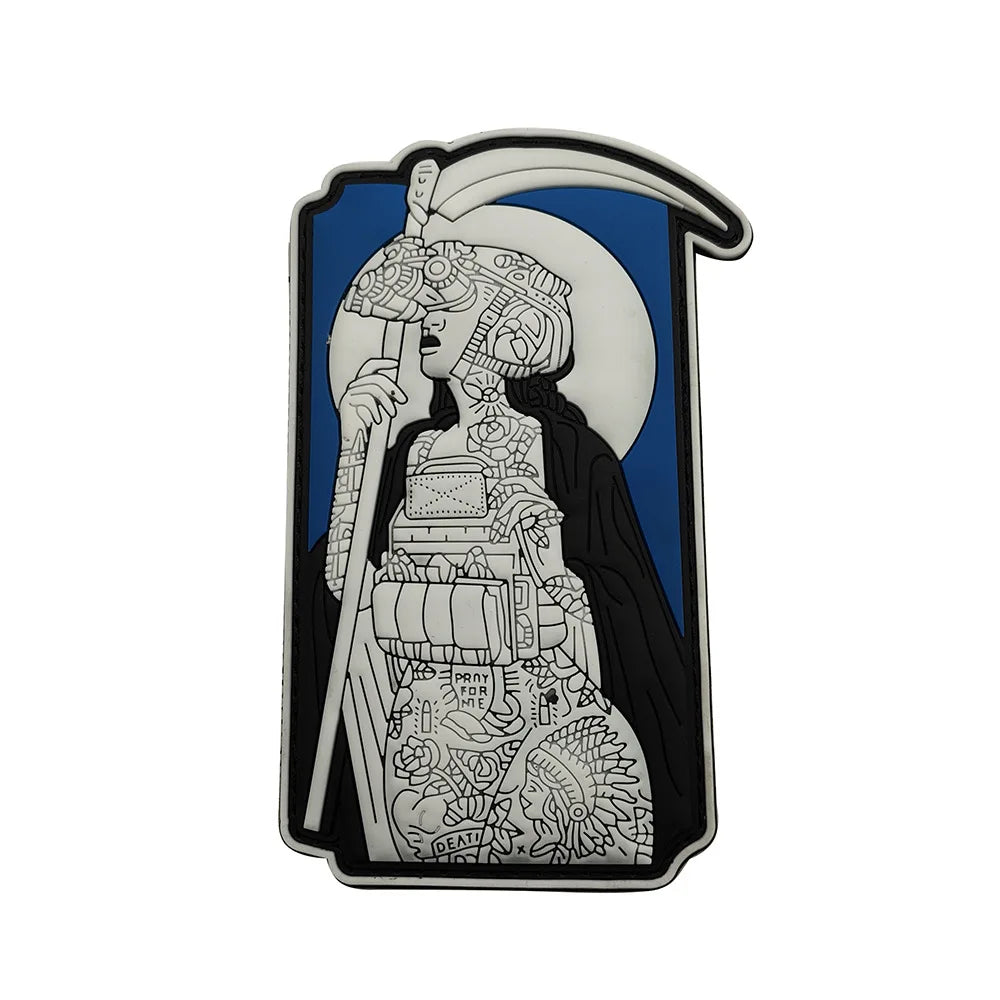 A black and white line art patch featuring a skull wearing a helmet and holding a staff against a blue background.