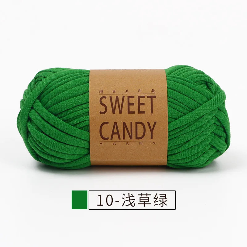 A ball of bright green sweet candy yarn labeled with Japanese text and the English words SWEET CANDY YARNS