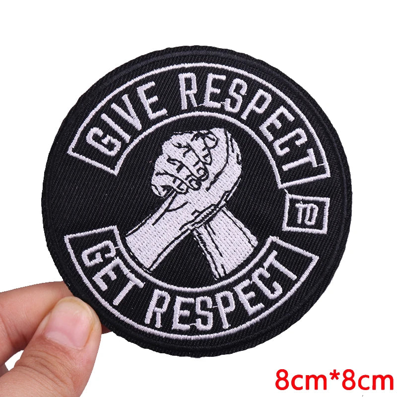 Black embroidered patch with white text that reads Give Respect to Get Respect