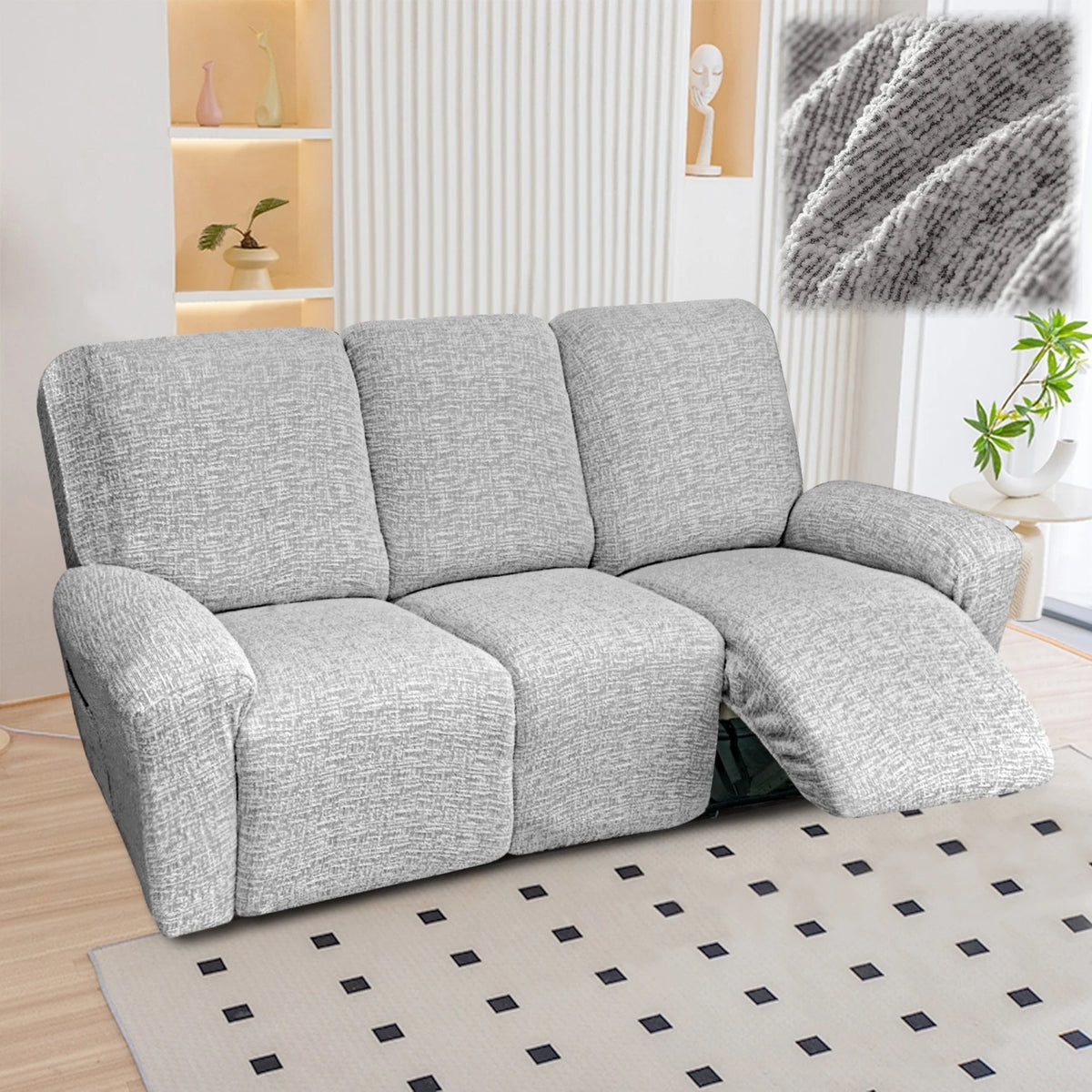 A gray heavy-duty chenille recliner sofa slipcover placed on a light rug.
