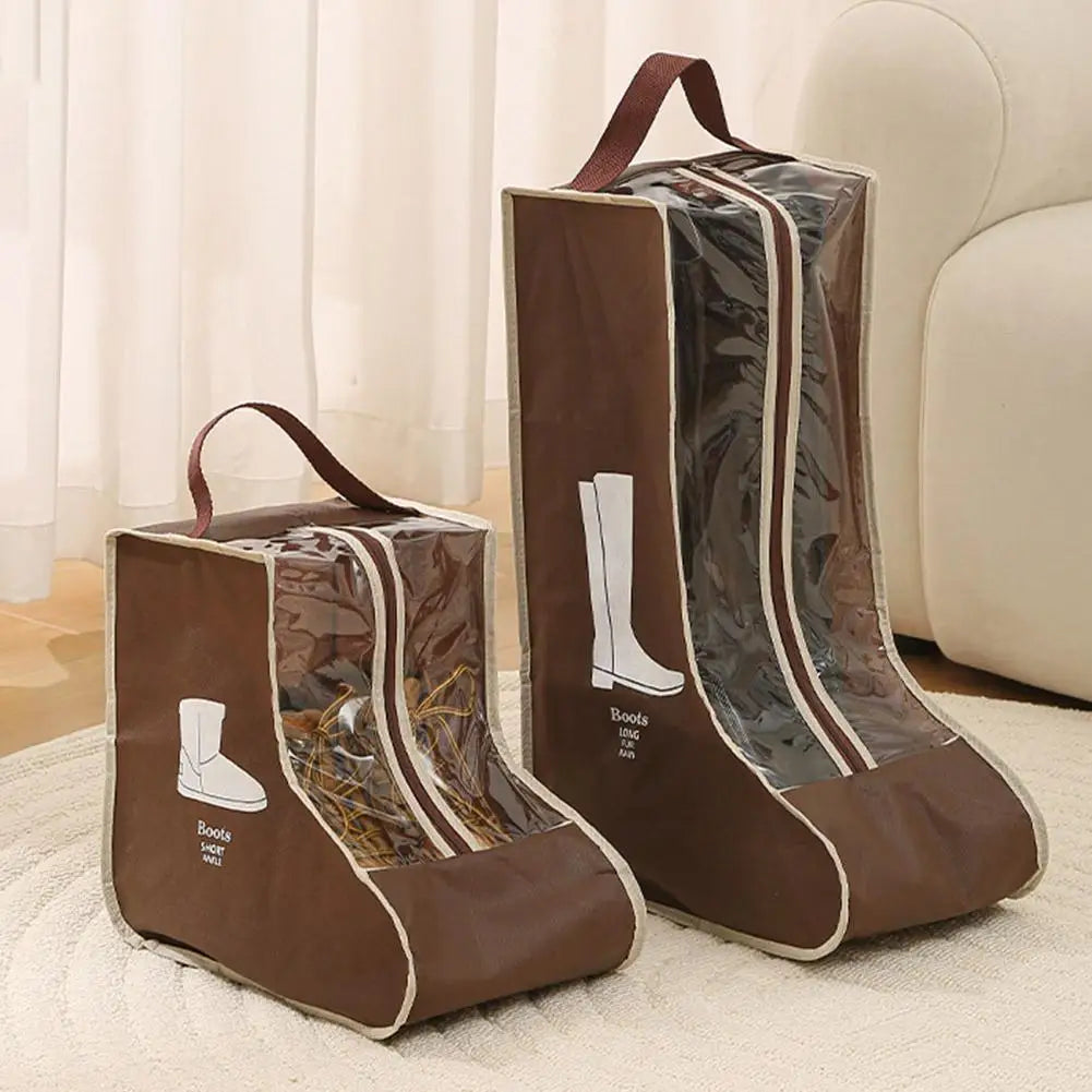 Two brown boot storage bags with clear windows and carry handles resting on a white rug.