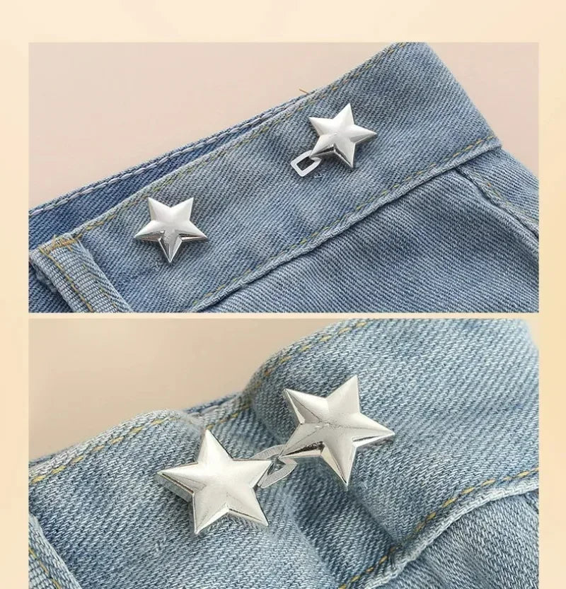Silver star brooch pins attached to denim fabric