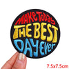 Black embroidered patch with yellow and blue text that reads Make Today The Best Day Ever