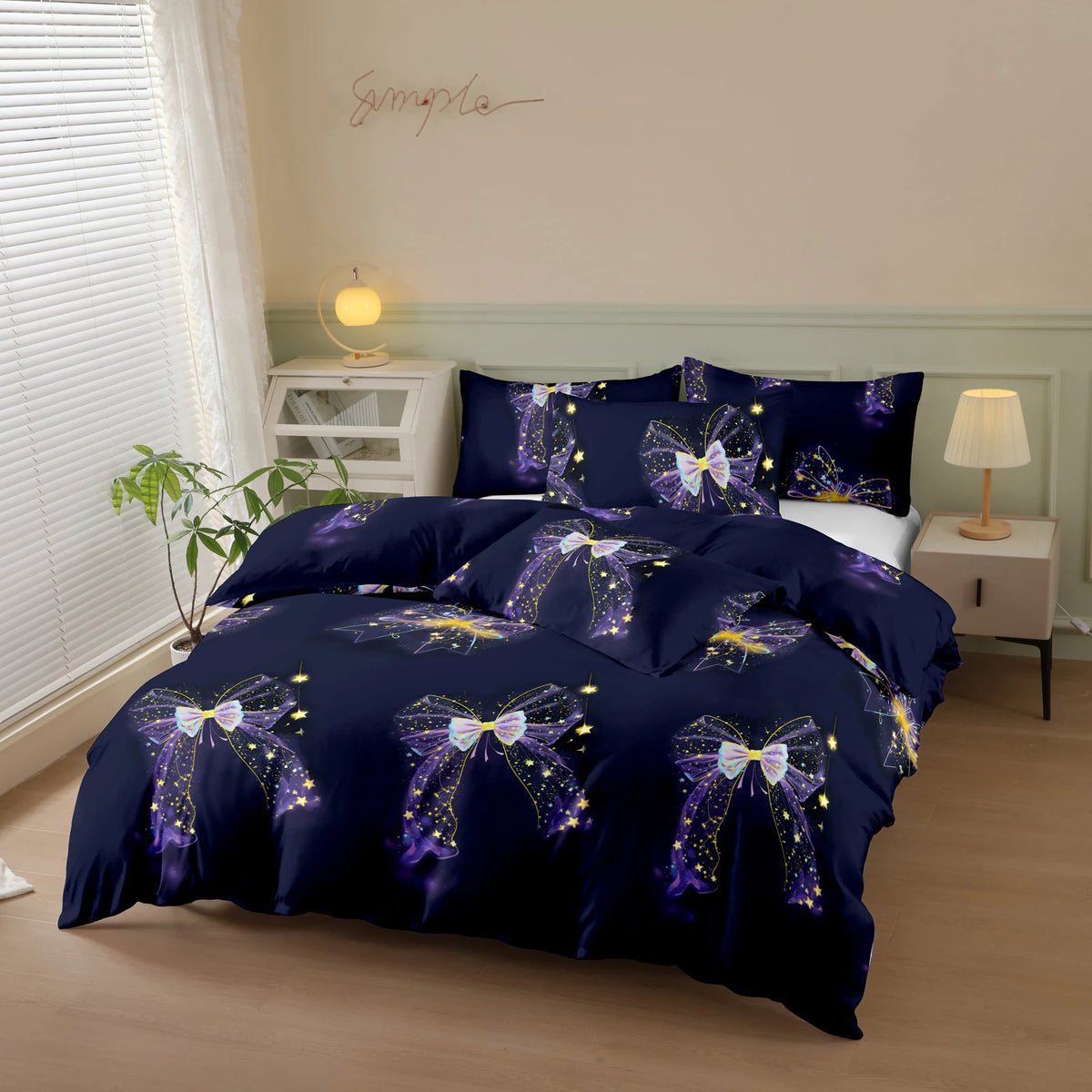 A navy blue duvet cover set featuring a butterfly print with gold and purple accents on a bed.