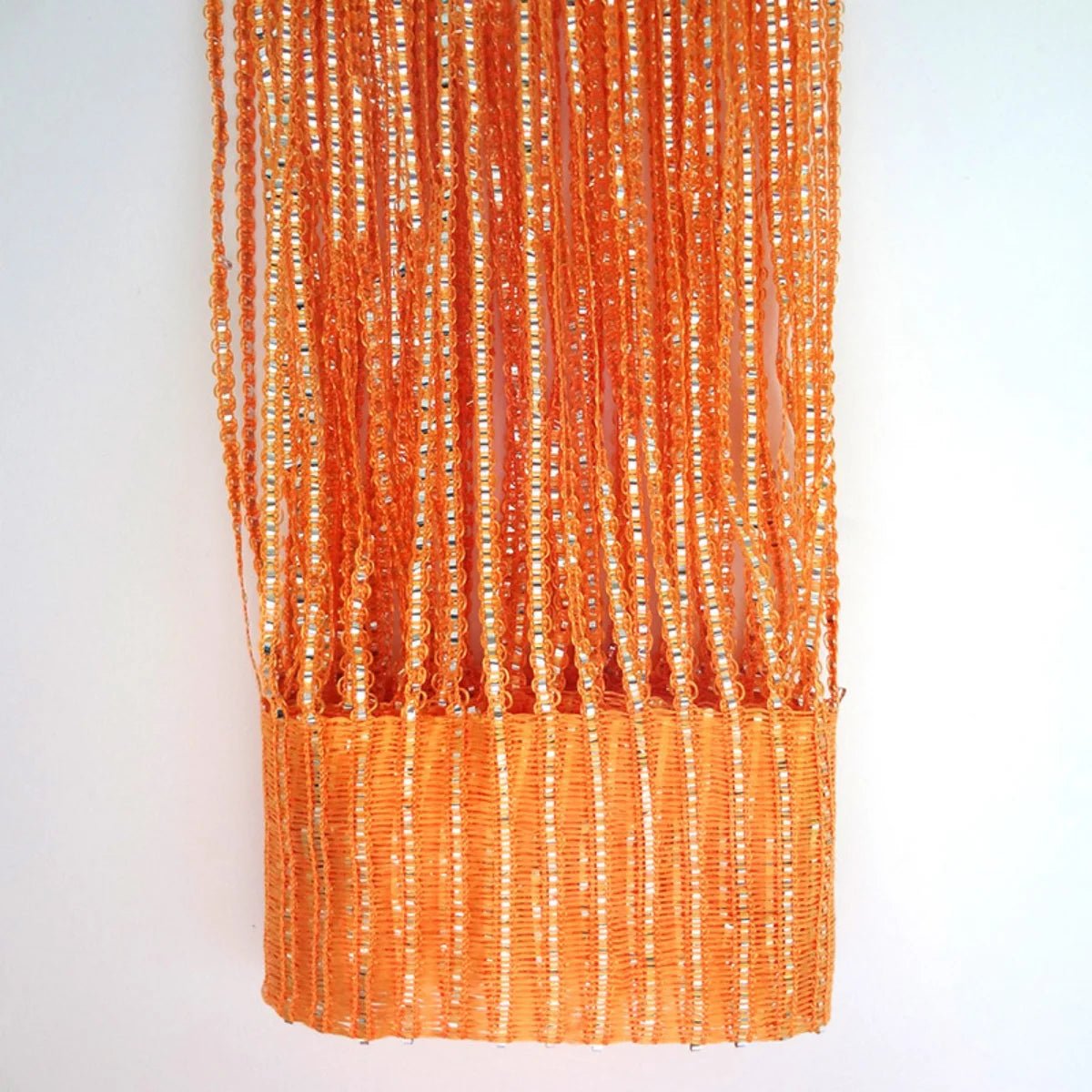 Orange decorative door string curtains with shimmering gold beads and fringe