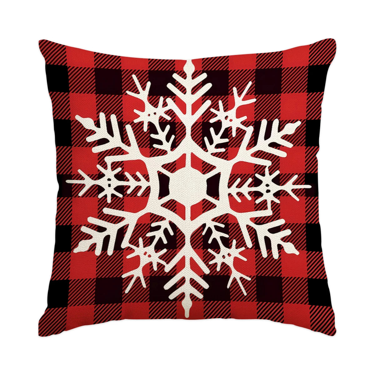 A red and black plaid pillow featuring a white snowflake design.