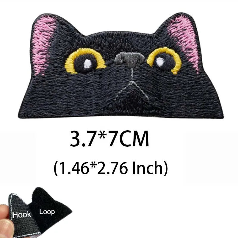 Black cat embroidered tactical patch with yellow eyes and pink accents