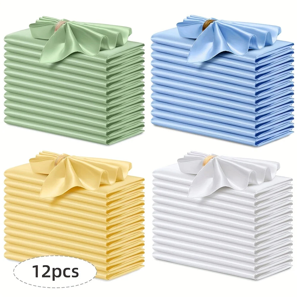A set of 12 silky satin dinner napkins in light green, blue, and white colors stacked neatly.