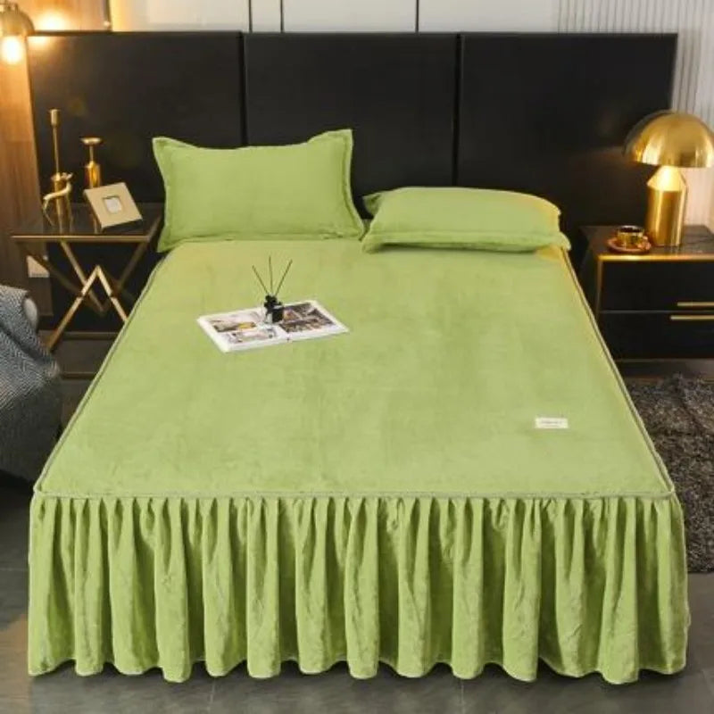 A lime green thick velvet bed skirt with pleats is displayed on a bed.