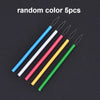 Five colorful needle threaders in blue, white, pink, yellow, and green are displayed on a dark background.