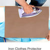 A hand places a purple iron onto a brown heat press transfer sheet for ironing clothes.
